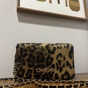 Bebe Gold and Black Leopard Clutch